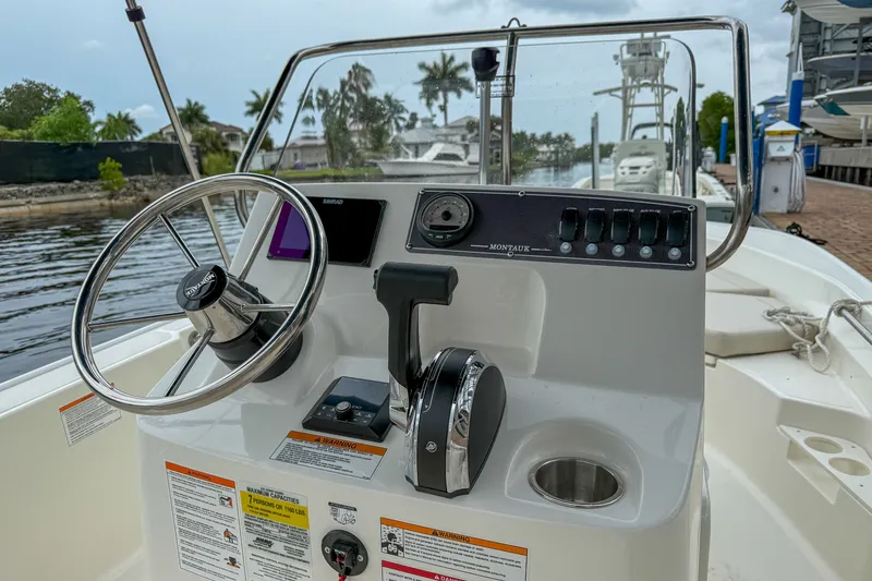 Slide: The Image of Steering console of a 2026 Boston Whaler 170 Montauk boat. - 8