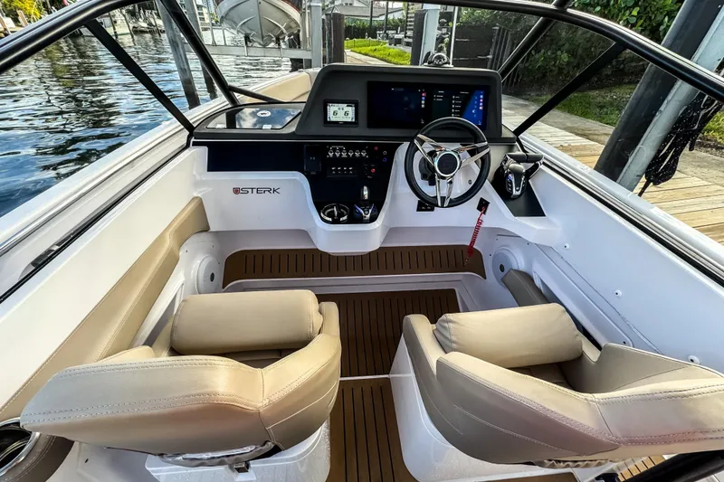 Slide: The Image of Interior of STERK 31 boat, 2025 model, featuring modern helm console. - 13
