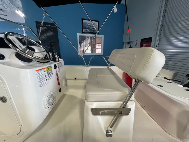 Slide: The Image of Interior view of the 2026 Boston Whaler 150 Montauk boat. - 13