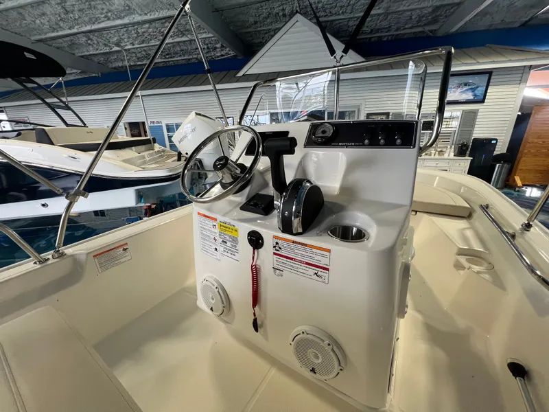 Slide: The Image of Interior view of the 2026 Boston Whaler 150 Montauk boat. - 17