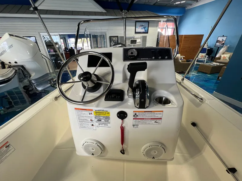 Slide: The Image of Interior view of 2026 Boston Whaler 150 Montauk helm. - 18