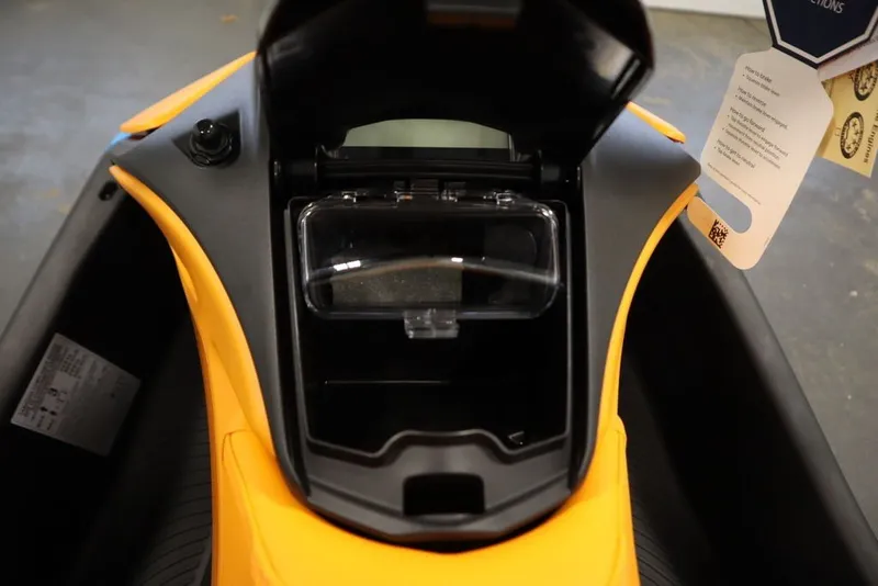 Slide: The Image of 2026 Sea-Doo Spark Trixx for 3 storage compartment, open view, showcasing interior design. - 13