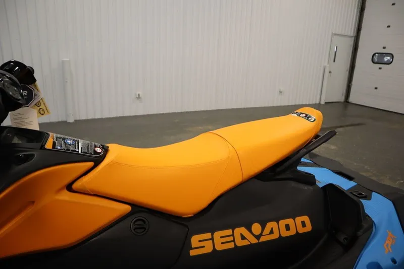 Slide: The Image of 2026 Sea-Doo Spark Trixx for 3, featuring vibrant orange seat and sleek design. - 12