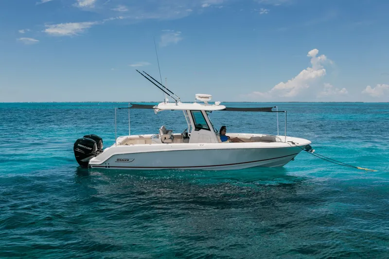 Slide: The Image of 2026 Boston Whaler 280 Outrage on calm, blue water with clear skies. - 41