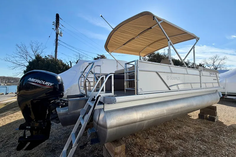 The Image of 2023 Godfrey Sweetwater 2286 SFL pontoon boat with Mercury engine and canopy. - 0