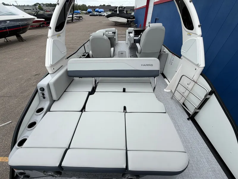 Slide: The Image of 2026 Harris Grand Mariner 230 pontoon boat with luxurious seating area. - 13