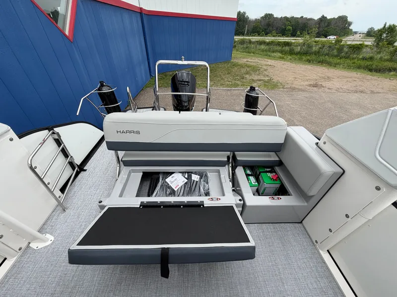 Slide: The Image of 2026 Harris Grand Mariner 230 with open storage and battery compartment. - 16