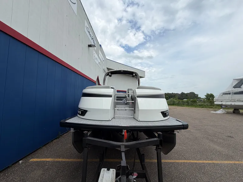 Slide: The Image of Harris Grand Mariner 230 boat, 2026 model, parked on a trailer. - 2