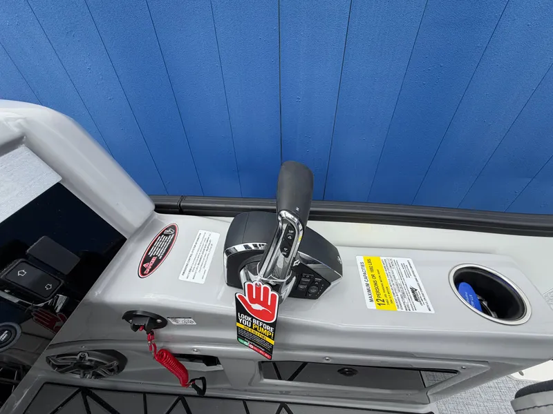 Slide: The Image of 2026 Harris Grand Mariner 230 control console with blue wall background. - 21