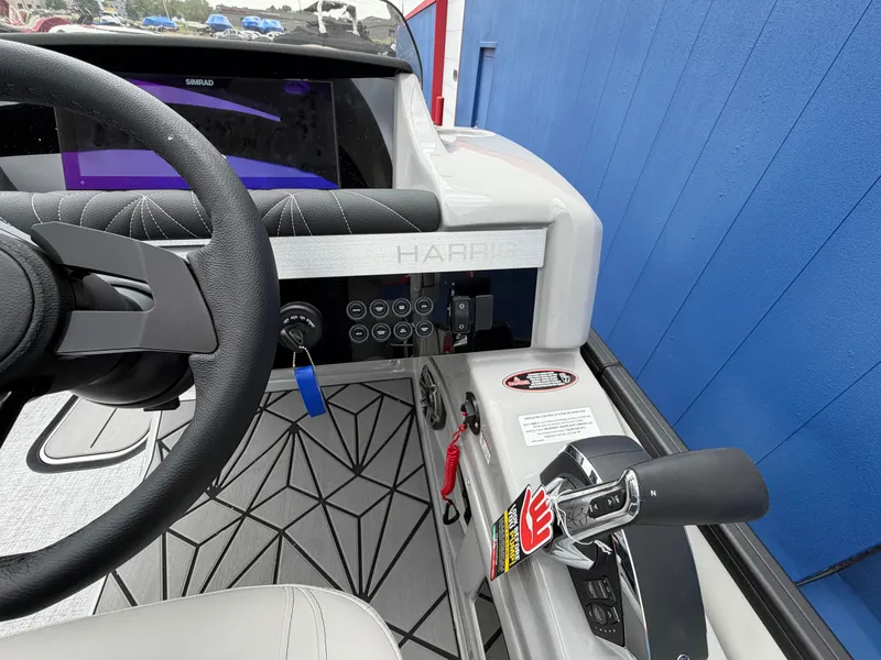 Slide: The Image of Interior view of Harris Grand Mariner 230 helm, model year 2026. - 22