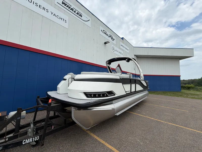 Slide: The Image of Harris Grand Mariner 230 pontoon boat 2026 at a yacht dealership. - 3