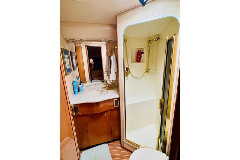 Slide: The Image of Bathroom interior of 2004 Viking 45 Convertible yacht with shower and vanity. - 12