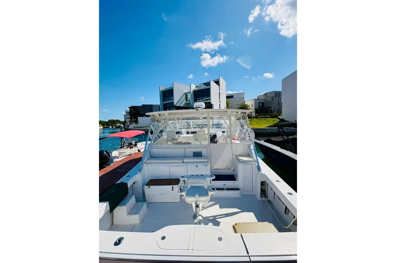 Slide: The Image of 2004 Viking 45 Convertible yacht docked under a clear blue sky. - 2