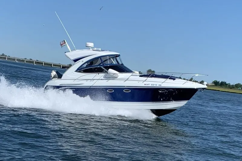 Slide: The Image of 2008 Formula 34 Performance Cruiser speeding on open water, clear blue sky. - 3