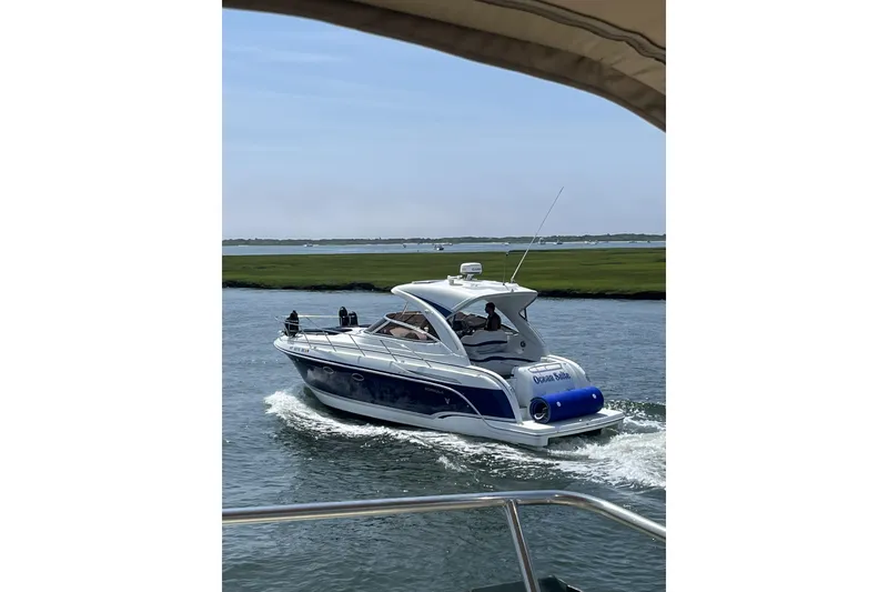 Slide: The Image of 2008 Formula 34 Performance Cruiser navigating a serene waterway. - 5