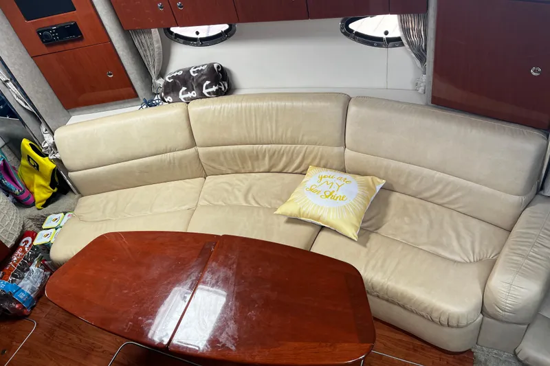 Slide: The Image of Interior of 2008 Formula 34 Performance Cruiser with beige leather seating and wooden table. - 6