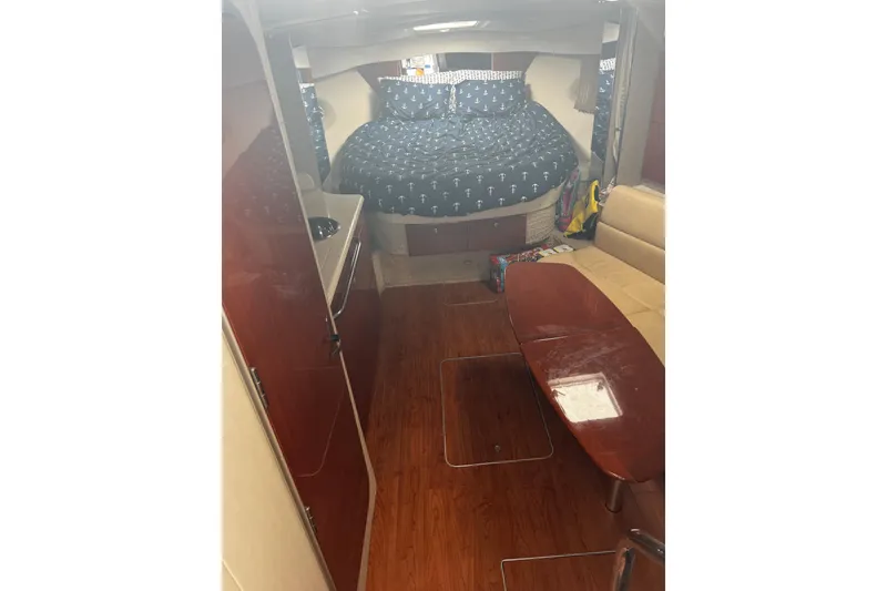 Slide: The Image of Interior of 2008 Formula 34 Performance Cruiser with wood flooring and cozy bed. - 7