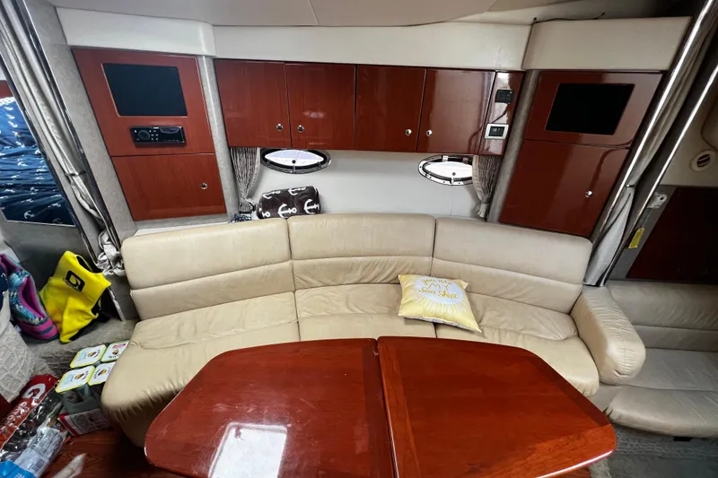 Slide: The Image of Interior of 2008 Formula 34 Performance Cruiser with beige seating and wooden cabinetry. - 8