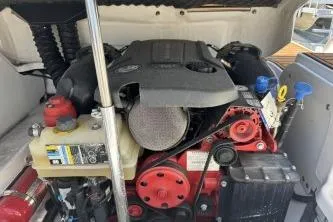 Slide: The Image of Engine compartment of a 2019 Bryant Calandra 23 boat, showcasing detailed components. - 7