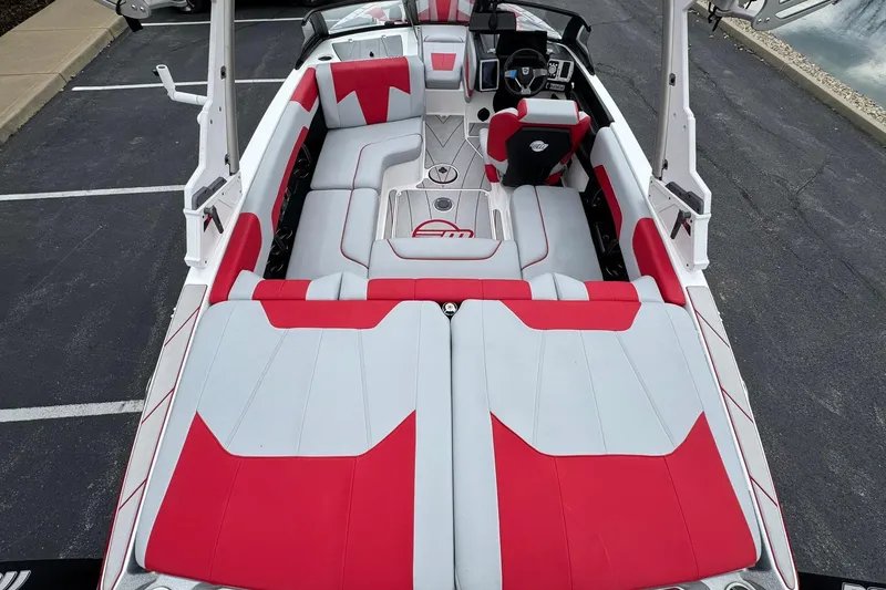 Slide: The Image of 2023 Malibu Wakesetter 20 VTX boat interior with red and white seating design. - 10