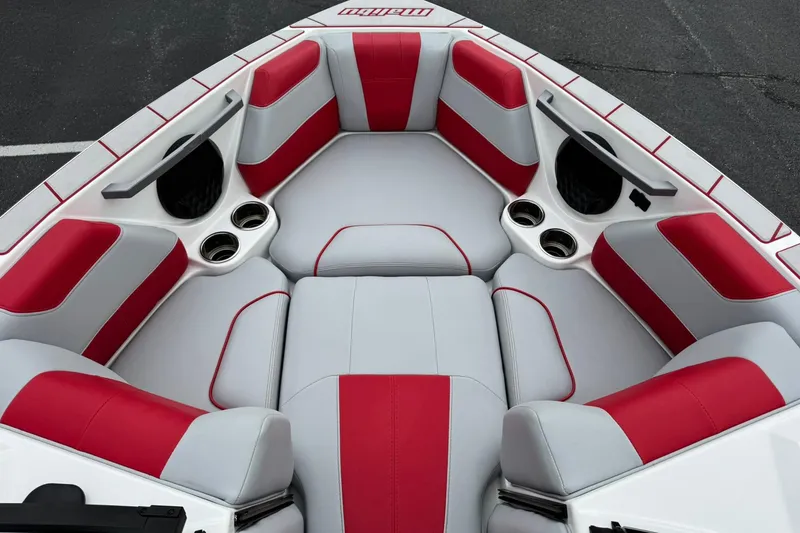 Slide: The Image of 2023 Malibu Wakesetter 20 VTX boat interior with red and gray seating, cup holders. - 12