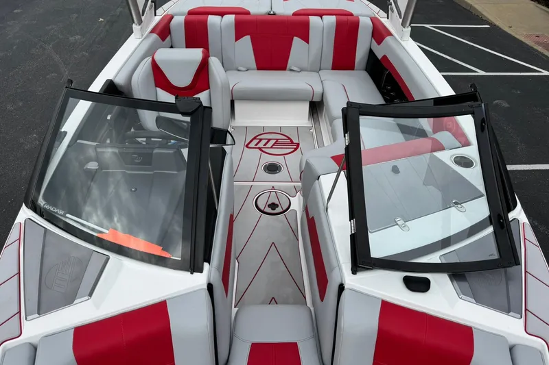 Slide: The Image of 2023 Malibu Wakesetter 20 VTX boat interior with red and gray seating. - 13