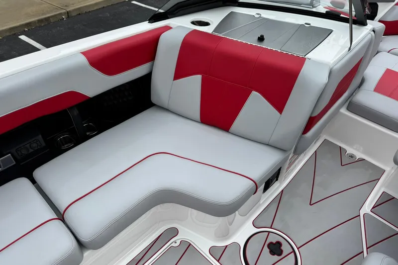 Slide: The Image of 2023 Malibu Wakesetter 20 VTX interior with red and gray seating design. - 16