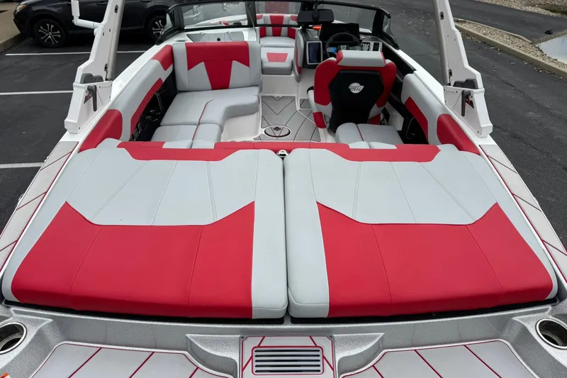 Slide: The Image of 2023 Malibu Wakesetter 20 VTX boat interior with red and white seating. - 9