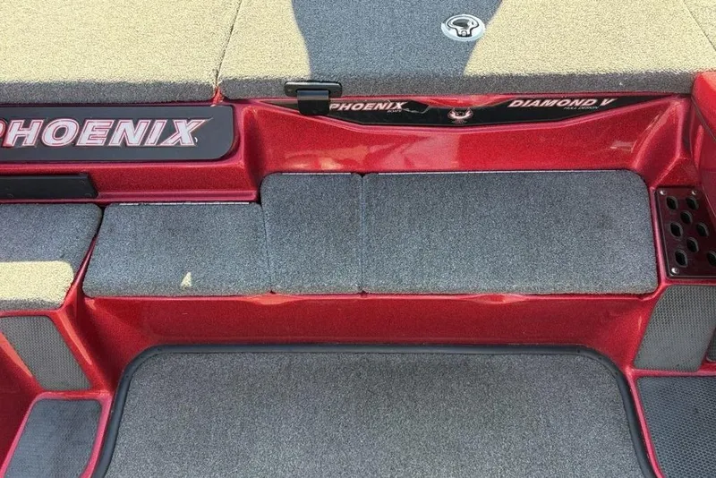 Slide: The Image of Open storage compartment in 2017 Phoenix 919 ProXP boat with gear inside. - 14