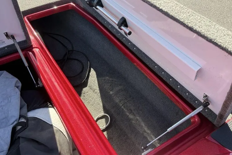 Slide: The Image of 2017 Phoenix 919 ProXP boat deck with gray carpet and red trim. - 16