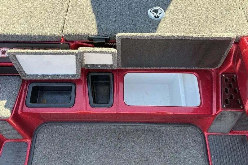 Slide: The Image of Open storage compartment of a 2017 Phoenix 919 ProXP boat with gear inside. - 18