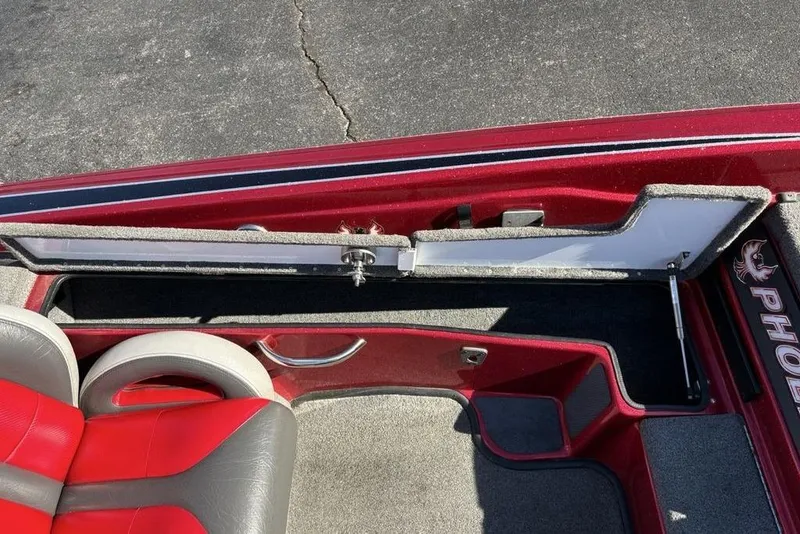 Slide: The Image of 2017 Phoenix 919 ProXP boat storage compartments with open lids, showcasing interior space. - 19