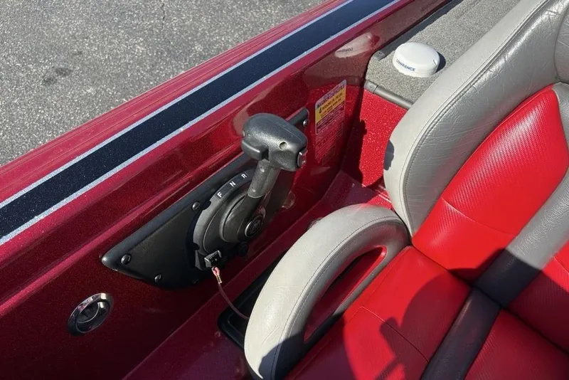 Slide: The Image of 2017 Phoenix 919 ProXP boat interior with red and gray seating, carpeted flooring. - 24