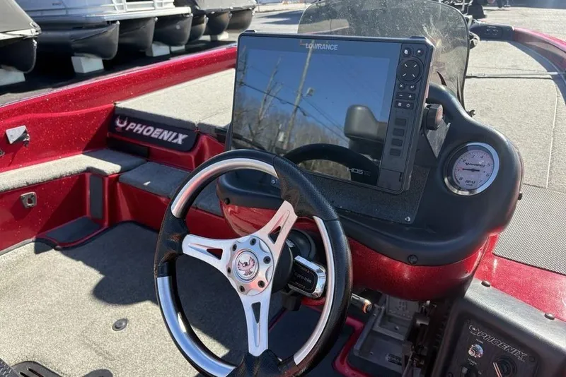 Slide: The Image of Red and gray interior of 2017 Phoenix 919 ProXP boat with control lever. - 25