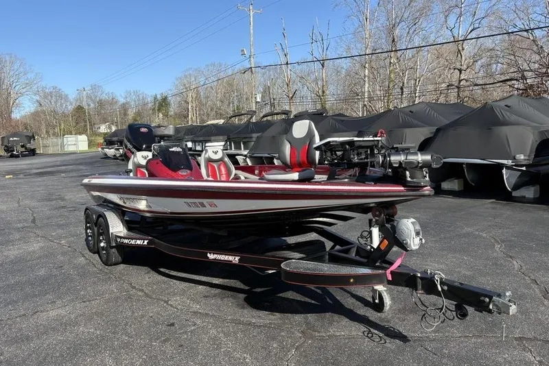 Slide: The Image of 2017 Phoenix 919 ProXP boat with Mercury engine, parked outdoors on a trailer. - 3