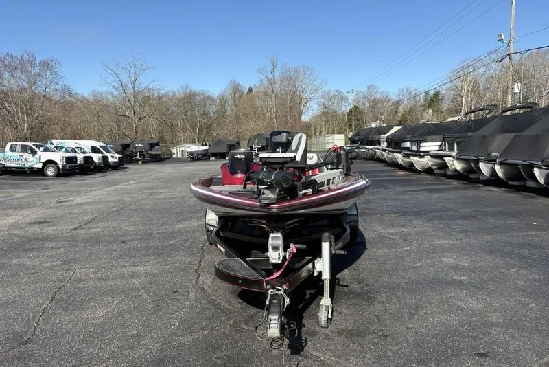 Slide: The Image of 2017 Phoenix 919 ProXP bass boat on trailer in outdoor storage area. - 4