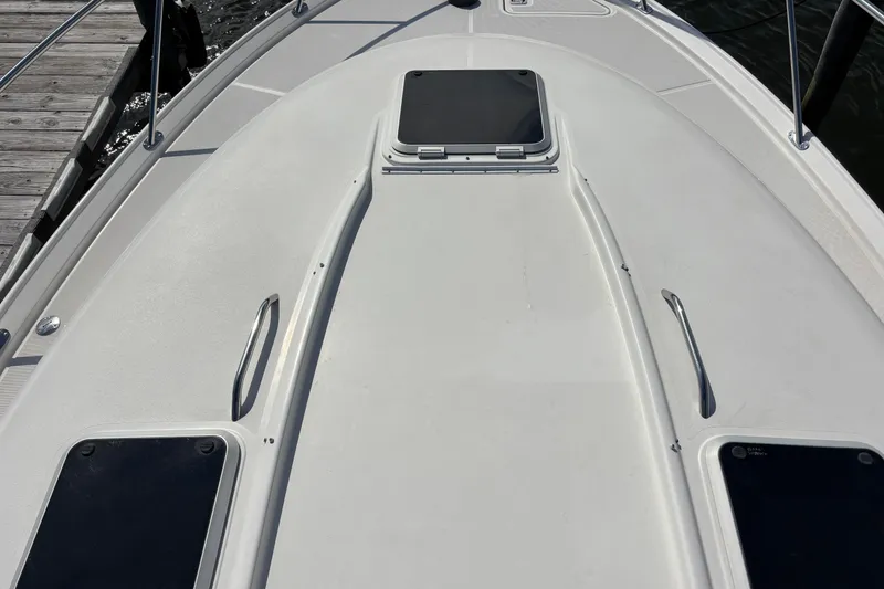 Slide: The Image of 2004 Tiara Yachts 3600 Sovran deck with hatch and railings, dockside view. - 13