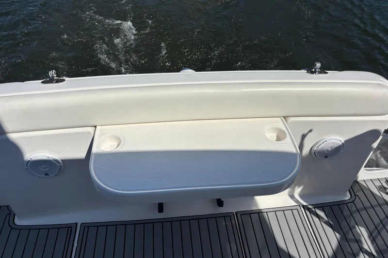 Slide: The Image of 2004 Tiara Yachts 3600 Sovran boat deck with seating and cup holders. - 14