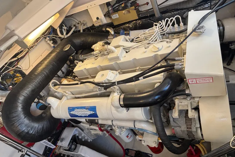 Slide: The Image of Engine room of a 2004 Tiara Yachts 3600 Sovran, featuring a powerful marine engine. - 19