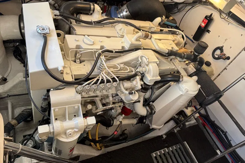 Slide: The Image of Engine compartment of a 2004 Tiara Yachts 3600 Sovran, showcasing detailed mechanical components. - 20