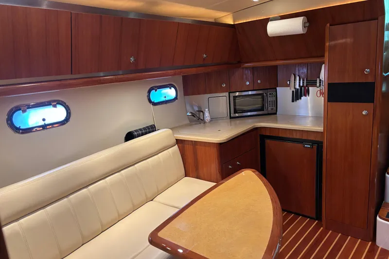 Slide: The Image of Luxurious 2004 Tiara Yachts 3600 Sovran interior with kitchenette and seating area. - 22