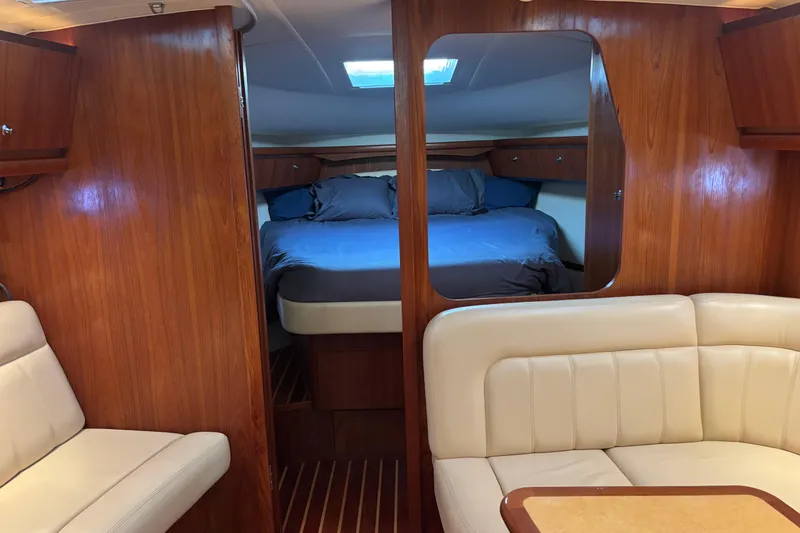 Slide: The Image of 2004 Tiara Yachts 3600 Sovran interior with cozy cabin and elegant wood finish. - 24