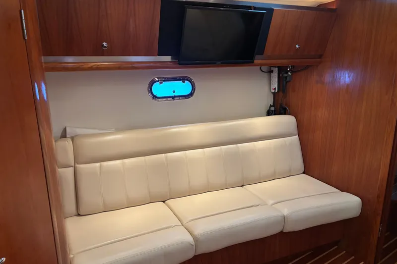 Slide: The Image of 2004 Tiara Yachts 3600 Sovran interior with cream leather sofa and wall-mounted TV. - 26