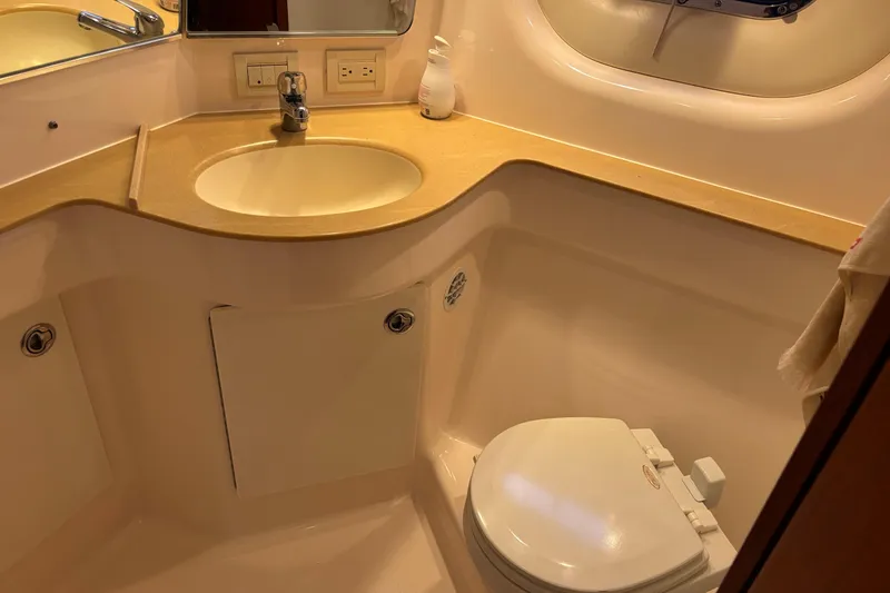 Slide: The Image of 2004 Tiara Yachts 3600 Sovran bathroom with sink, toilet, and mirror. - 29