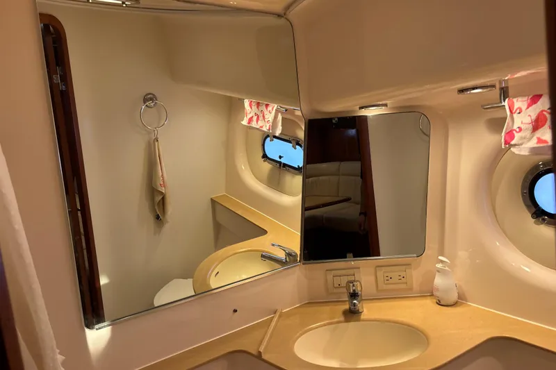 Slide: The Image of Luxurious bathroom interior of 2004 Tiara Yachts 3600 Sovran with mirror and sink. - 30