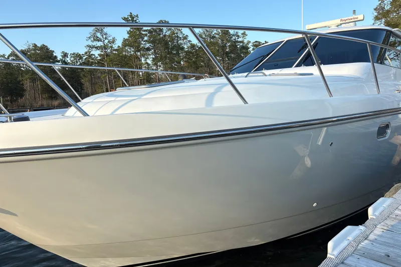 Slide: The Image of 2004 Tiara Yachts 3600 Sovran docked, showcasing sleek design and polished exterior. - 6