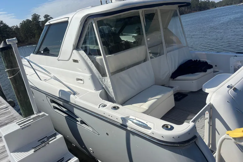 Slide: The Image of 2004 Tiara Yachts 3600 Sovran docked, featuring sleek design and comfortable seating. - 8