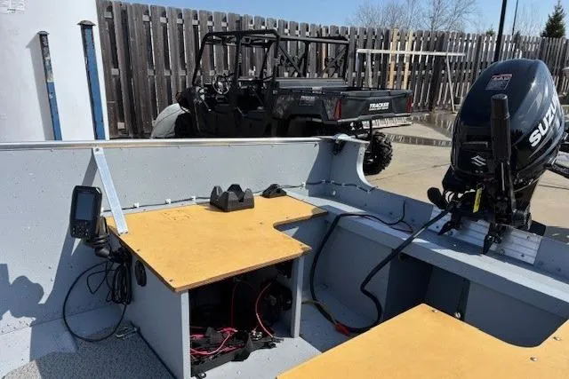 Slide: The Image of 2023 Lund SSV-14 Tiller boat interior with Suzuki outboard motor and electronic equipment. - 3