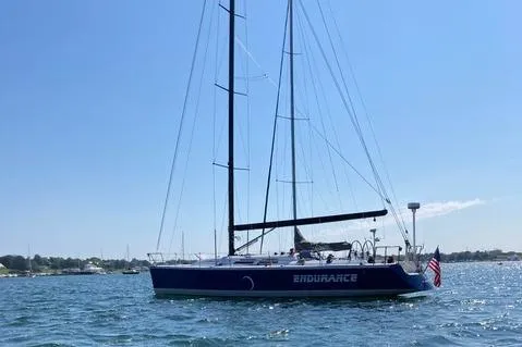 Slide: The Image of Sailing yacht "Endurance" on water, Tripp 47 model, 1995, with American flag. - 11