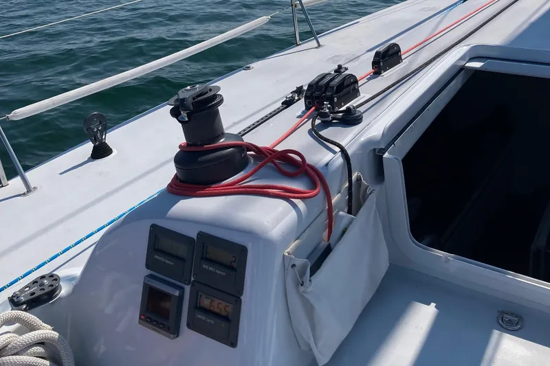 Slide: The Image of Sailing yacht Tripp 47 cockpit with winch and ropes, 1995 model, on open water. - 14